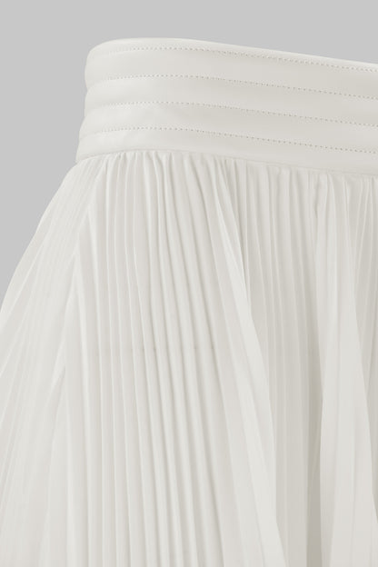 ASYMMETRIC PLEATED SKIRT W/ VEGAN LEATHER WAIST