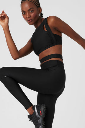 Model wearing Airlift High-Waist All Access Legging and matching bra showcasing stylish cutout details.