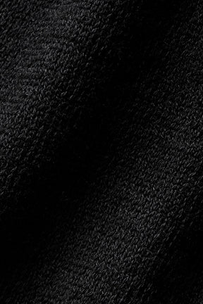 Close-up of lightweight black knit fabric of the Supernatural Sweater Henley Tank, highlighting its soft and breathable texture.