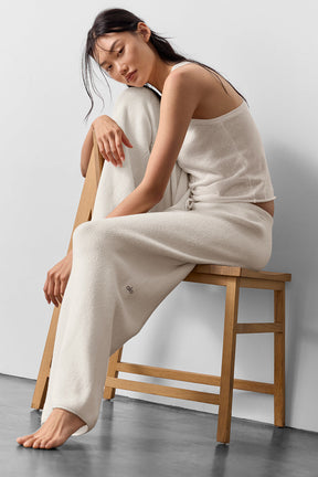 Model wearing Supernatural Sweater Henley Tank and matching pants, featuring a lightweight knit and relaxed fit.