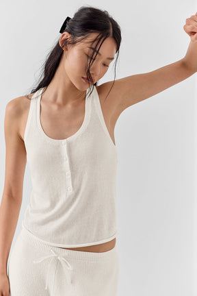 Model wearing Supernatural Sweater Henley Tank in lightweight knit, showcasing classic button front and relaxed fit.