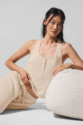 Model wearing Supernatural Sweater Henley Tank in a lightweight knit paired with comfortable pants, styled for a relaxed look.