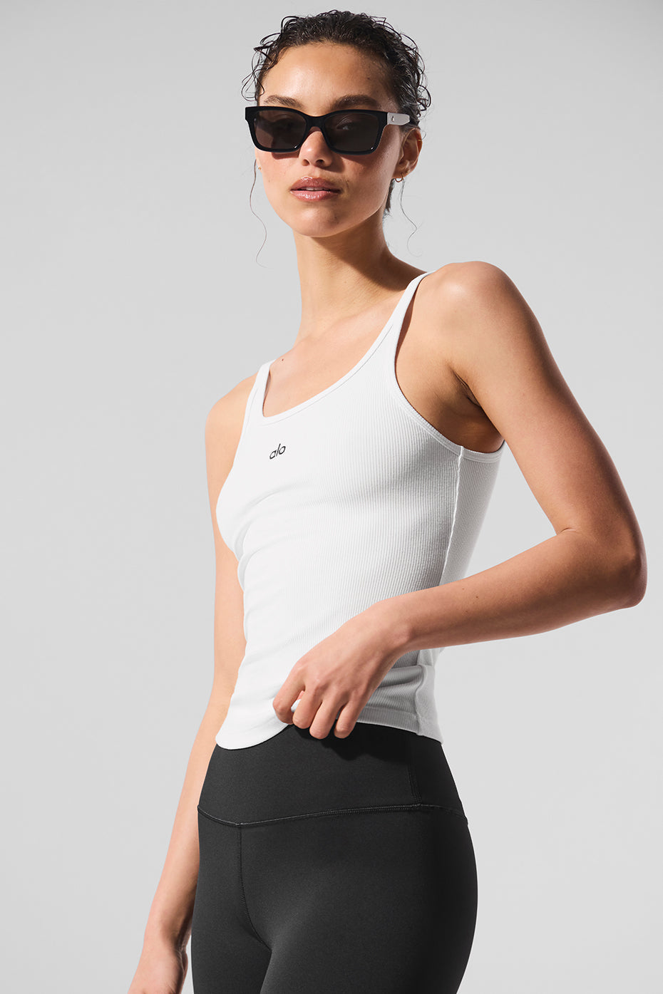 Ribbed Prosper Tank in white with minimalistic design, perfect for layering or casual outfits with leggings.
