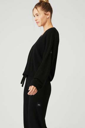 Cashmere Jet Set V-Neck Pullover in black, featuring a relaxed fit, dropped shoulders, and ribbed cuffs, styled with matching bottoms.