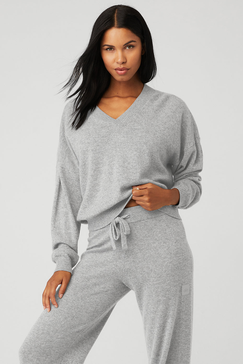 Cashmere Jet Set V-Neck Pullover in gray, featuring dropped shoulders and ribbed cuffs for cozy winter wear.