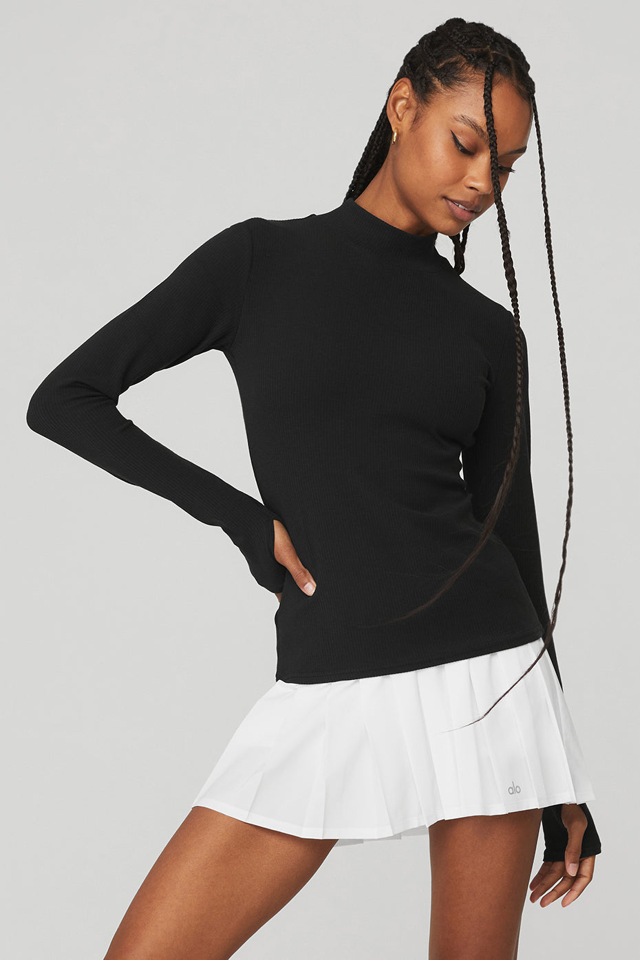 Wellness Rib Mock Neck Long Sleeve in black, a sleek and comfy top perfect for layering or casual wear.
