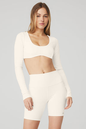 Ribbed Defined Long Sleeve Bra in soft white with scoop neck, paired with matching shorts, designed for comfort and support.