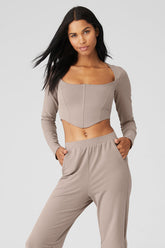 ALOs Softsculpt Long Sleeve crop top with sweetheart neckline and corset panels in soft micro French terry fabric.