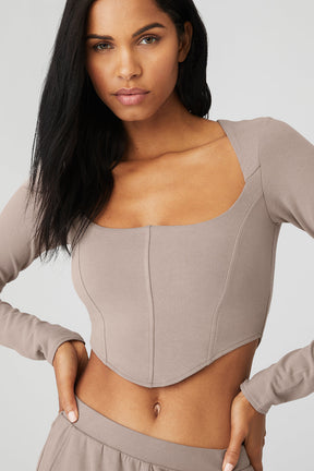 ALO Softsculpt long sleeve crop top in micro French terry with corset panels and sweetheart neckline.