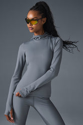 Airlift Winter Warm Hooded Runner in grey, designed for comfort and performance in cold weather workouts.