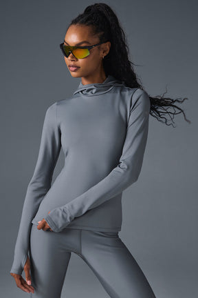 Airlift Winter Warm Hooded Runner in grey, designed for comfort and performance in cold weather workouts.