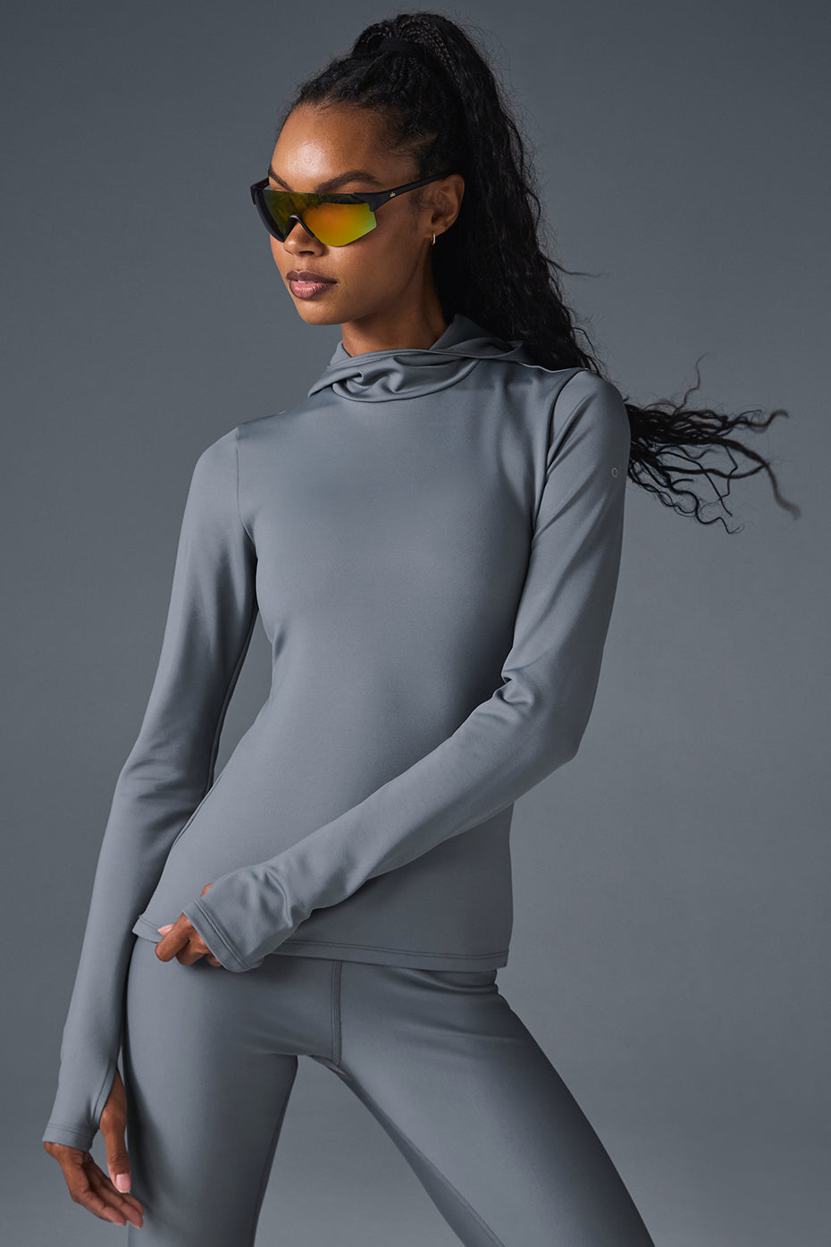 Airlift Winter Warm Hooded Runner in grey, designed for comfort and performance in cold weather workouts.