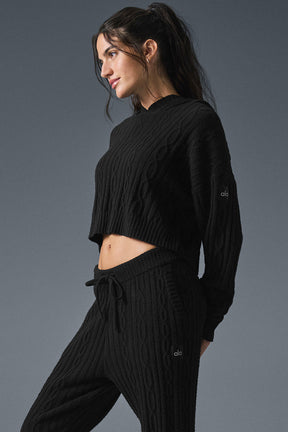 Cable Knit Winter Bliss Hoodie in black, featuring a cropped hem and relaxed fit, paired with matching pants for a cozy winter look.