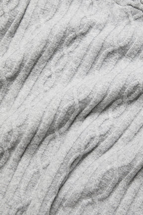 Close-up of the soft gray cable knit texture of the Winter Bliss Hoodie, showcasing its cozy design and relaxed fit.