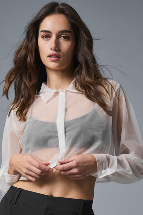 Sheer cropped button up with point collar and hidden placket, worn over a tonal bralette.