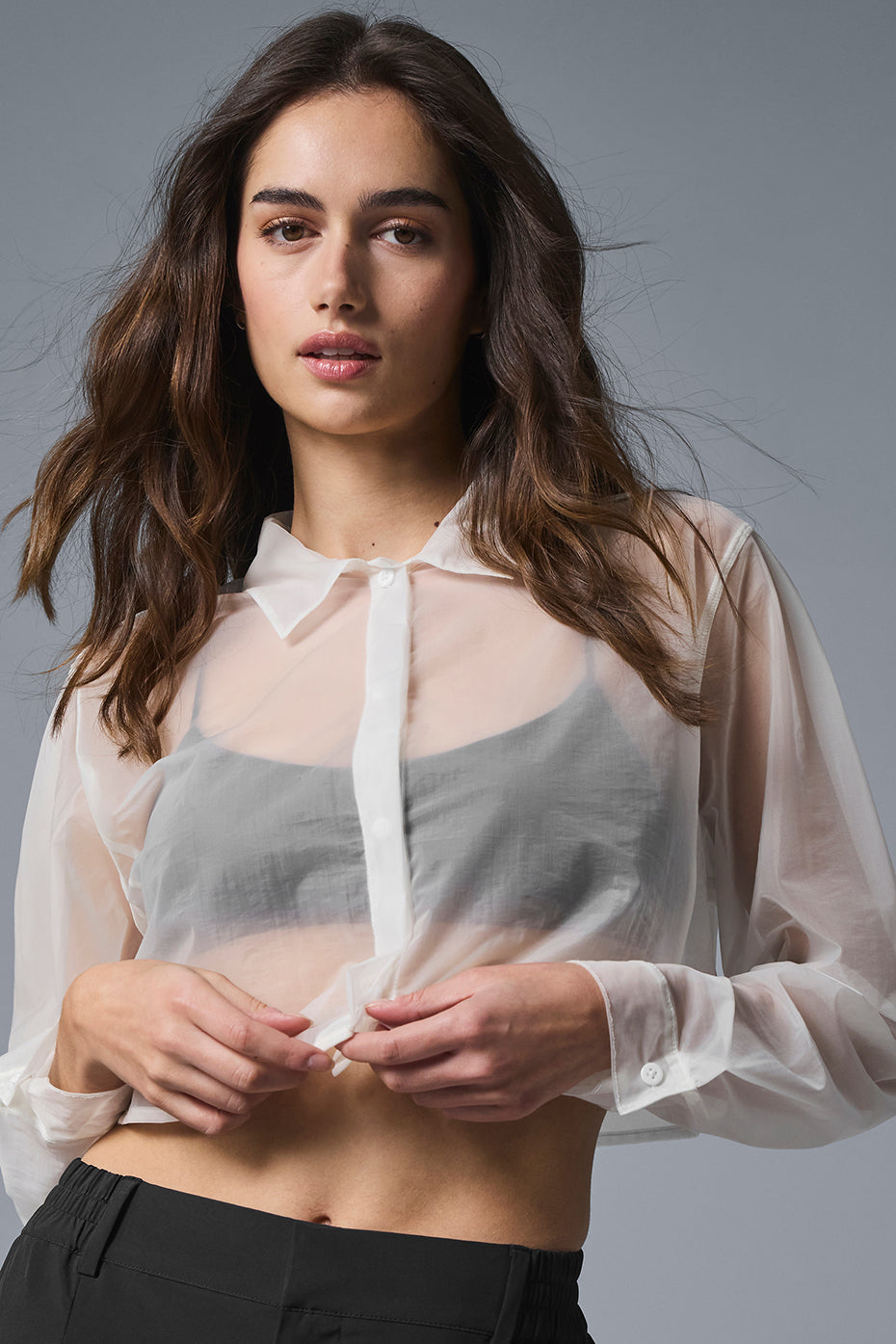 Sheer cropped button up with point collar and hidden placket, worn over a tonal bralette.