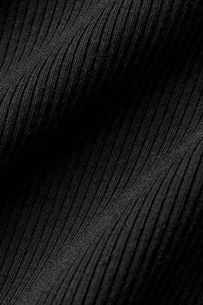Close-up of ribbed black fabric showcasing the texture of the Ribbed Mesmerize Long Sleeve shirt.