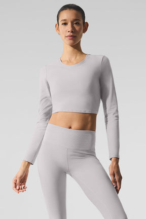 Washed Alosoft Crop Finesse Long Sleeve in light gray, featuring a cropped silhouette and chic design.