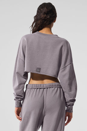 Back view of a woman wearing a washed extreme cropped pullover with matching joggers in a chic gray fabric.