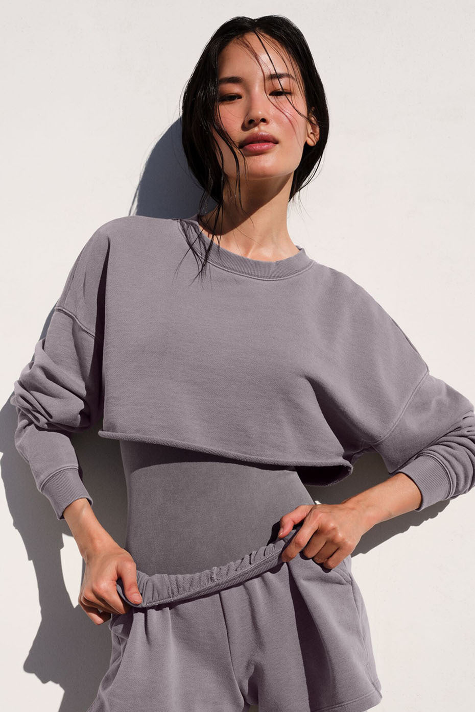 Washed Extreme Cropped Pullover worn by model, showcasing ultra-chic style and cropped silhouette.