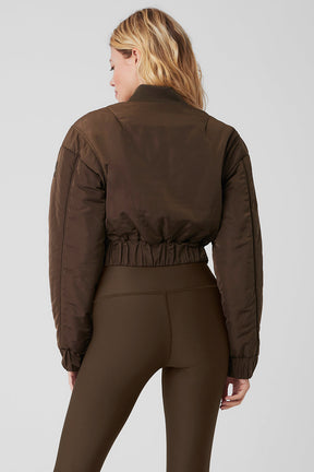 Cropped Break Line Bomber Jacket featuring memory woven fabric, ribbed cuffs, and waistband, worn with leggings.