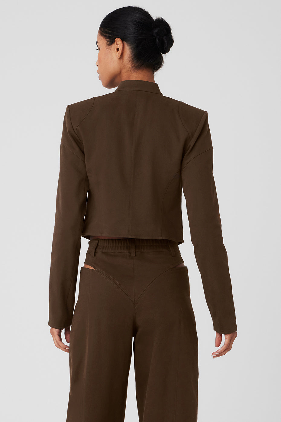 Back view of a cropped Full Throttle Moto Jacket showcasing its form-defining fit and subtle shoulder pads.