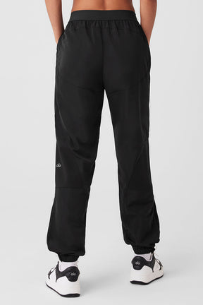 Back view of the Mixed Media Reinvention Jogger featuring a stretchy ALO waistband and relaxed fit.