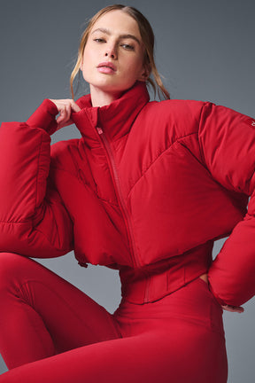 Main Act Corset Puffer jacket in red with a cropped silhouette and corset hemline for winter warmth