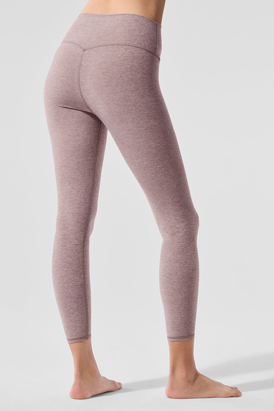 Alosoft High-Waist 7/8 Highlight Legging showcased on a model, featuring a contouring back seam and soft fabric for yoga and everyday wear.