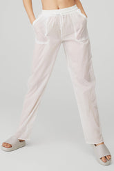 Cloud Nine Pant in white, featuring high waist, drawcord, zippered pockets, and lightweight fabric for comfort.