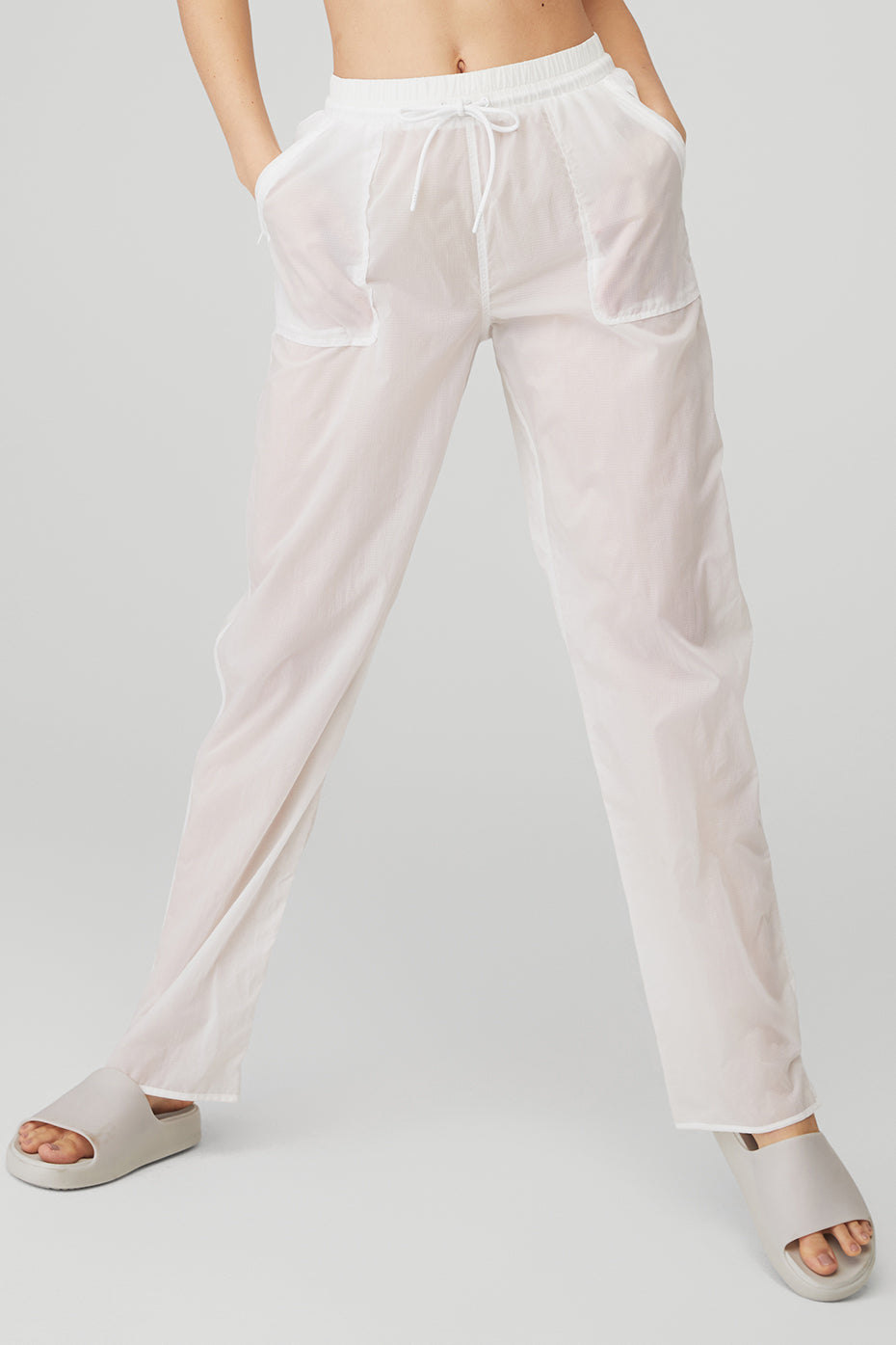 Cloud Nine Pant in white, featuring high waist, drawcord, zippered pockets, and lightweight fabric for comfort.
