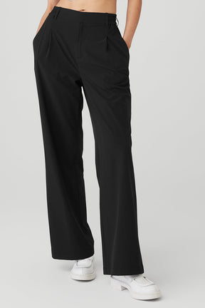 Black high-waist pursuit trousers with a relaxed wide-leg fit and pleats, perfect for work and casual outings.