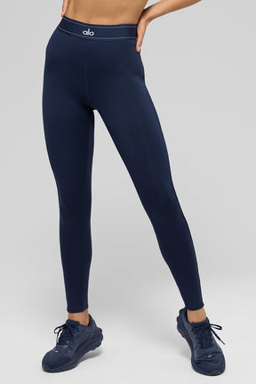 Airlift high-waist Suit Up legging in navy blue featuring boxer-style waistband and body-contouring piping.