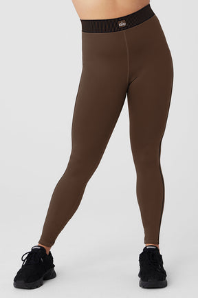 Airlift High-Waist 7/8 Line Up Legging in brown worn by a model, showcasing a versatile and stylish activewear look.