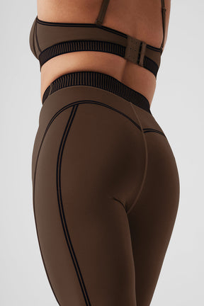 Airlift High-Waist 7/8 Line Up Legging in brown, showcasing flocking detail and a flattering fit for studio and street wear.