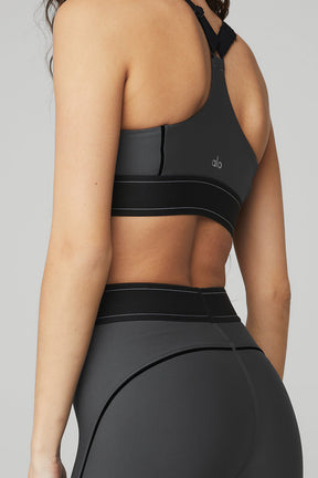 Back view of woman wearing Airlift high-waist legging and matching bra showcasing body-contouring design.