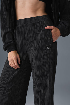 High-waist micro plisse straight leg pant with relaxed fit and crinkly mini-pleat texture, perfect for a stylish casual look.