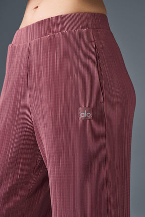 High-waist micro plisse straight leg pant highlighting crinkly texture and relaxed fit.