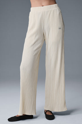 High-waist micro plisse straight leg pant with a relaxed fit and soft mini-pleat texture in a light color