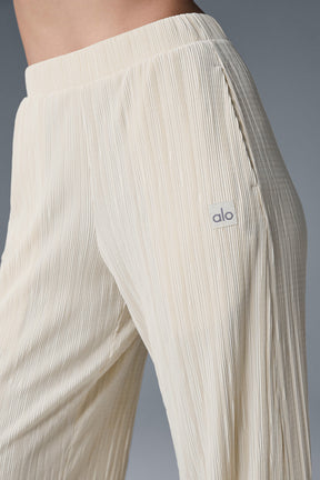 High-waist micro plisse straight leg pant featuring a relaxed fit and soft mini-pleat texture for elevated comfort.