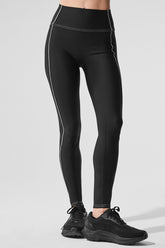 Airlift High-Waist Legging in black showing high waist and exposed seams for a flattering silhouette.