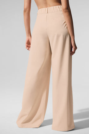 Back view of High-Waist Dreamscape Trouser in lightweight crinkle woven fabric, showcasing a flowy and stylish fit.