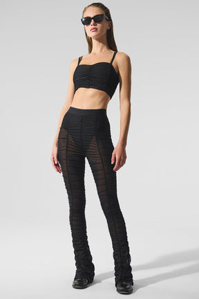 Model wearing Airlift Mesh High-Waist Cherish Legging paired with a matching bra, showcasing a stylish flared design.