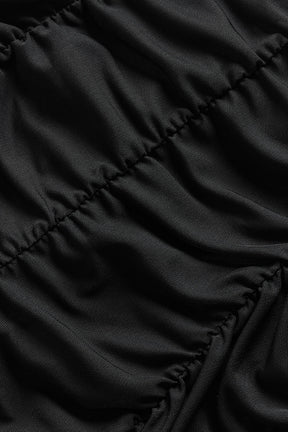 Close-up of the textured fabric of a black Airlift Mesh High-Waist Cherish Legging with gathered details.