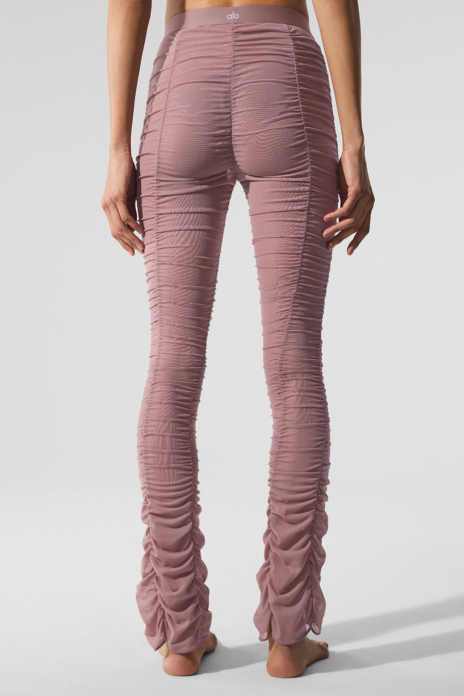 Airlift Mesh High-Waist Cherish Legging in pink with a flared leg and ruched design, showcasing a stylish back view.