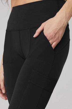 Close-up of the High-Waist Cargo Legging in black with pockets, showcasing sculpting Airbrush fabric and high waist design.