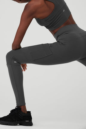 High-Waist Cargo Legging in dark gray featuring pockets for essentials and sculpting fabric for a smooth fit.