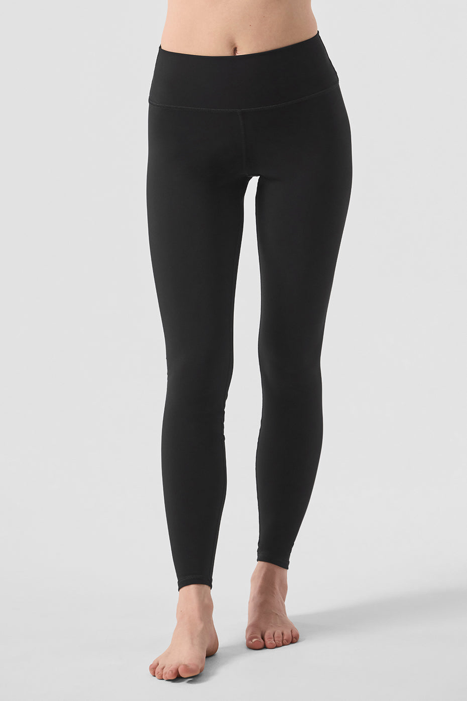 High-waist solid vapor legging in black featuring a sleek design and ultralight second-skin fabric, perfect for yoga.