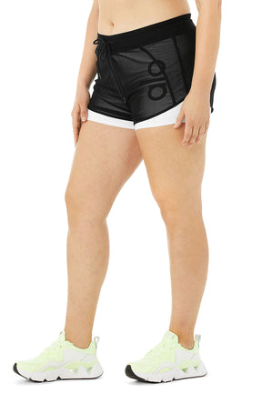 Ambience Short in black featuring dual layers and elastic waist, perfect for studio-to-street wear and comfort.