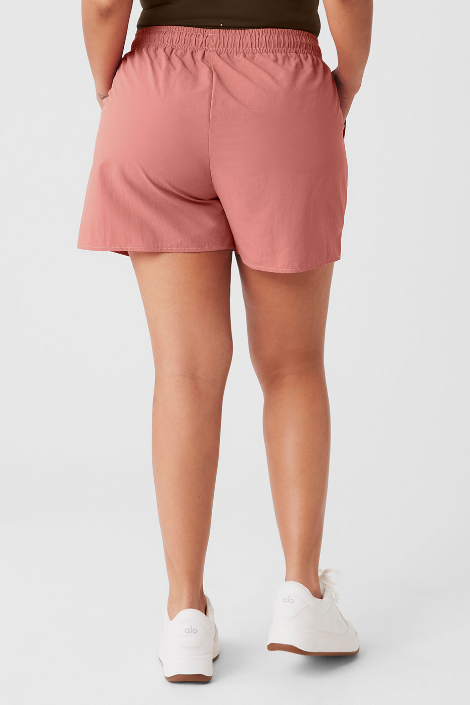 Back view of women's Alumni Short in lightweight fabric, featuring high-waist design and elastic waistband.